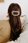 Flat Round Hair Clip in Blonde Tortoise - styled in a half-up, half-down hairstyle