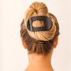 Flat Round Hair Clip in Jet Black - styled in a complete updo hairstyle