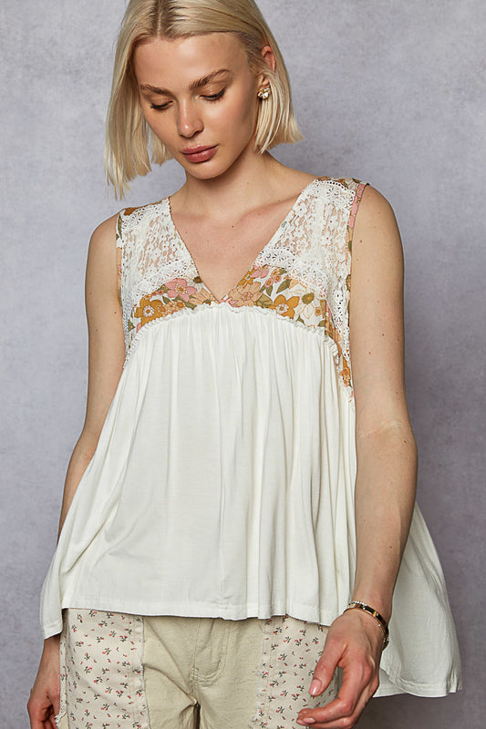 Woman wearing the Juniper Bloom Top with a blank background.