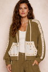 woman wearing an olive boho jacket with crochet detail and relaxed fit on a neutral background, lightweight boutique jacket styled with casual outfit for everyday wear