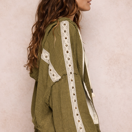 side view of woman wearing an olive boho jacket with crochet detail and relaxed fit on a neutral background, lightweight boutique jacket styled for casual everyday outfits
