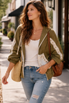 woman walking outdoors wearing an olive boho jacket with crochet detail and relaxed fit styled with jeans and a tank, lightweight boutique jacket for casual everyday outfits and layering