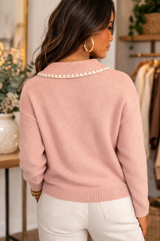 Back view of blush pink knit sweater with sweetheart collar detailed styled with light neutral bottoms.