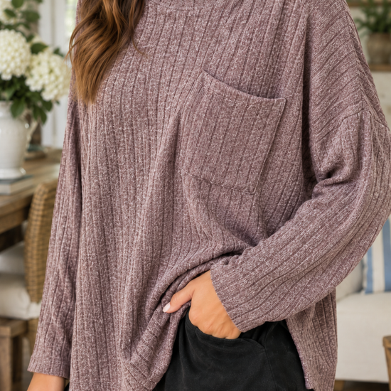 Close-up of women's heathered plum ribbed knit pocket top showing chest pocket, round neckline and textured knit