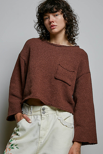 Model wearing POL Clothing brown cropped open-knit sweater with rolled neckline and chest pocket