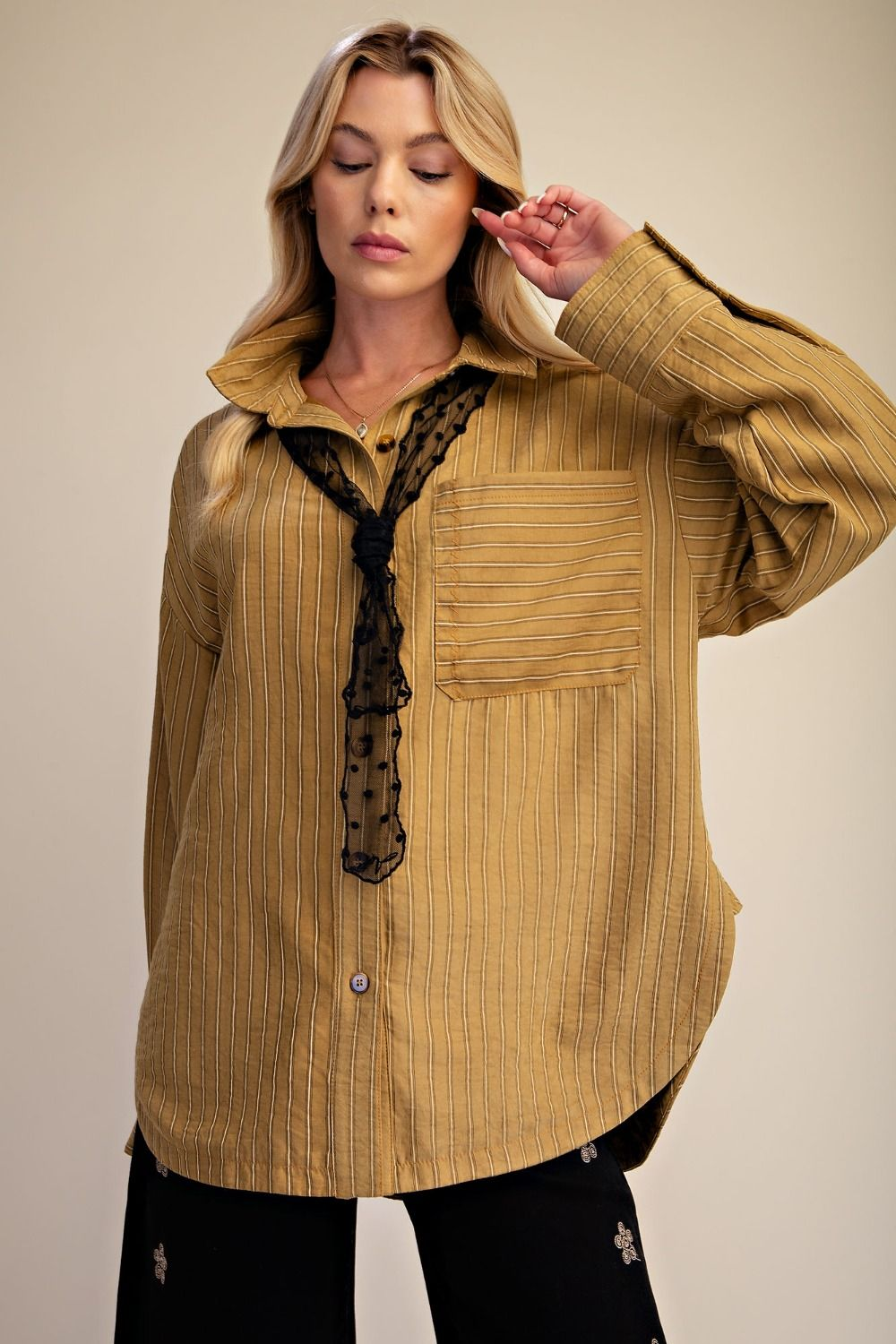 Golden Kiwi poly twill striped oversized button down shirt styled open over a black lace cami