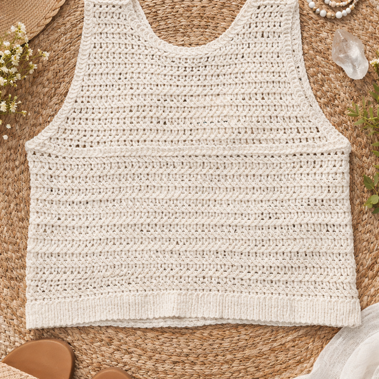 Back view of natural crochet button vest in a soft neutral tone, featuring open-knit texture and relaxed boho silhouette styled on a woven backdrop with earthy accessories