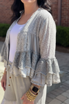 Close-up detail of Boho Patchwork Lace Ruffle Shrug showing lace trim and ruffle sleeve