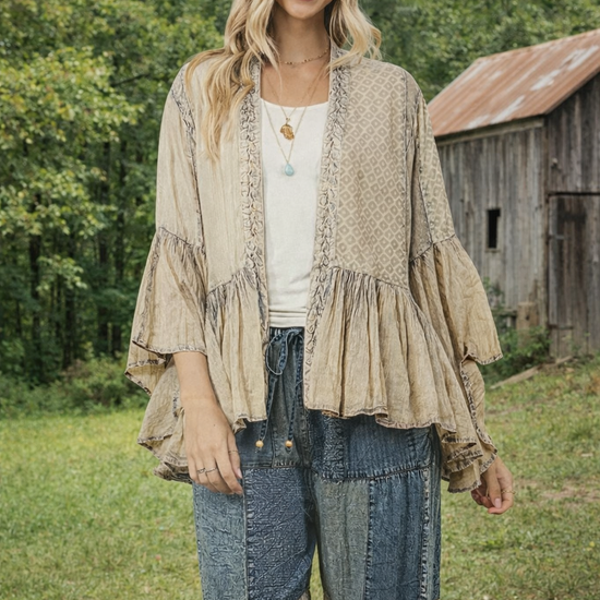 Young Threads Elegant Boho Frill Kimono Shrug in latte neutral, styled with patchwork pants and a felt hat, featuring flowy sleeves and a relaxed boho silhouette outdoors